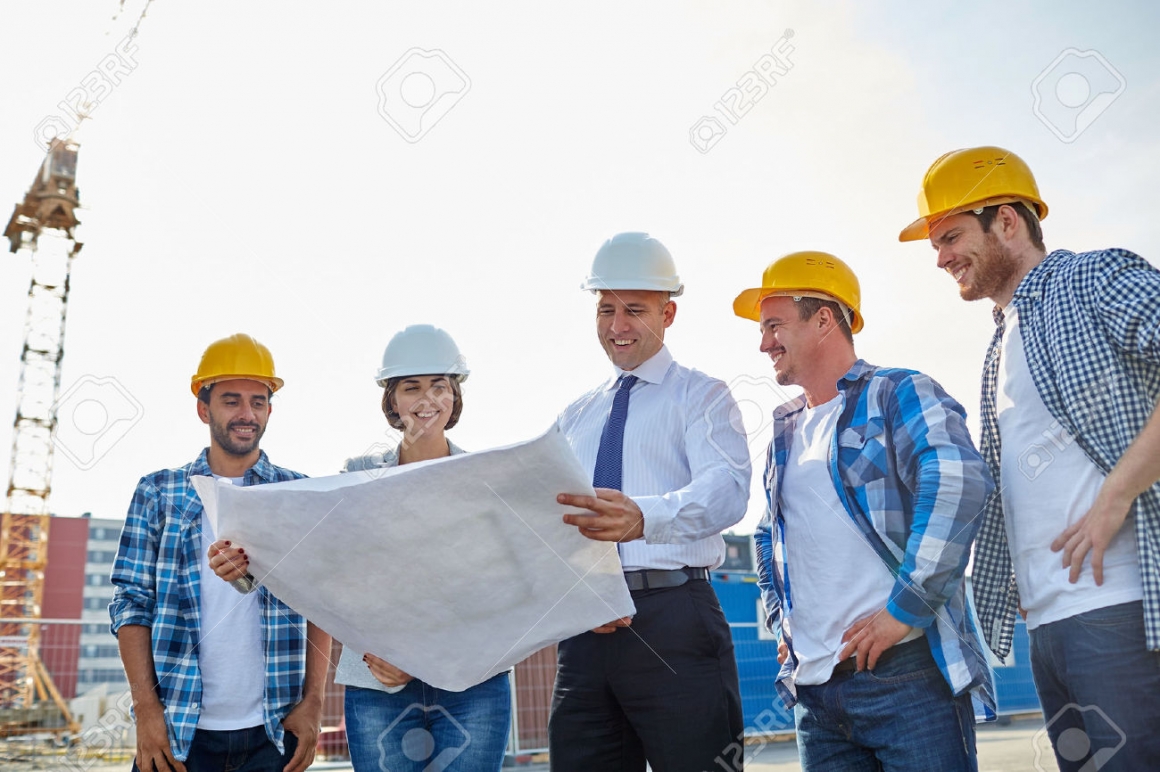48507600-business-building-teamwork-and-people-concept-group-of-builders--Stock-Photo